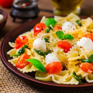 Caprese pasta salad with tomatoes and mozzarella, perfect for the Mediterranean diet